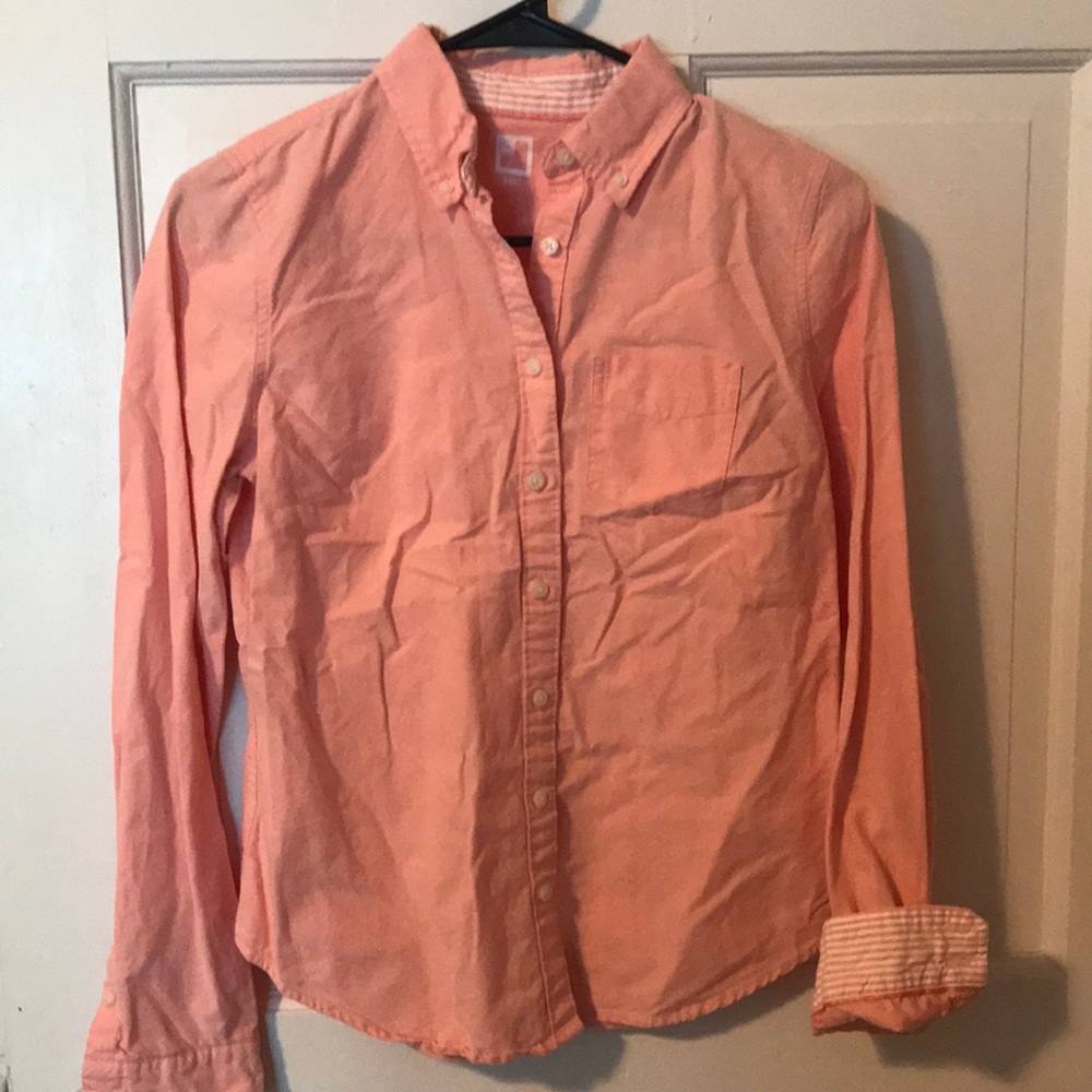 Peach colored button down shirt